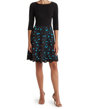 Load image into Gallery viewer, FOCUS BY SHANI - Ponte Fit &amp; Flare Laser Cut Dress